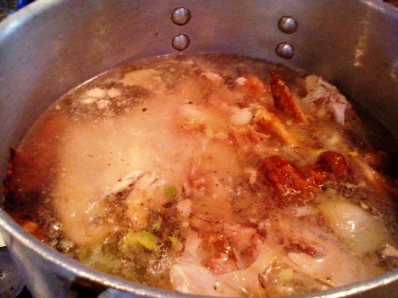 Turkey stock with onions, celery and bell peppers.